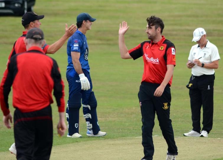 Noah Davies and Tim Hicks celebrate another Carew wicket against Haverfordwest at the Racecourse. Picture Gordon Thomas